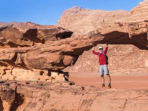 Trek Jordan main image - solo traveller on rocks - Jordan
