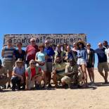 A group at the Tropic of Capricorn in Namibia | On The Go Tours
