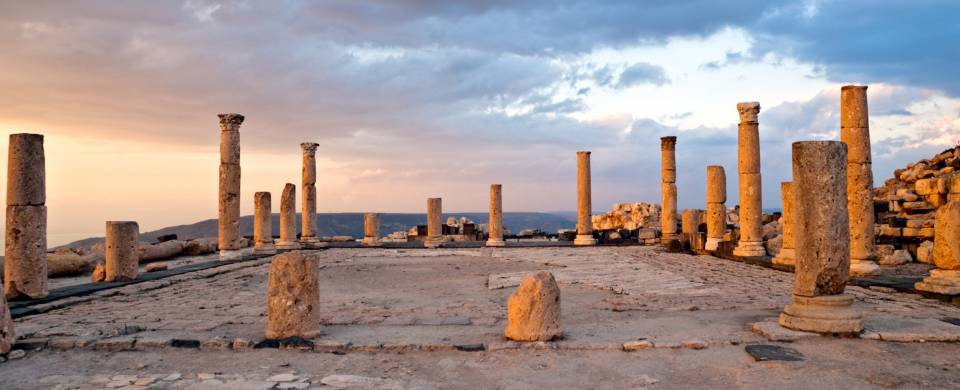 Pillars against the setting sun at Umm Qais