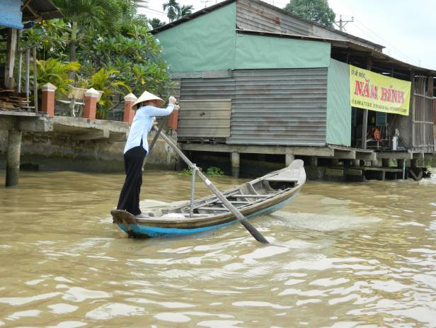 Boat making its way along the Mekong Delta near Can Tho