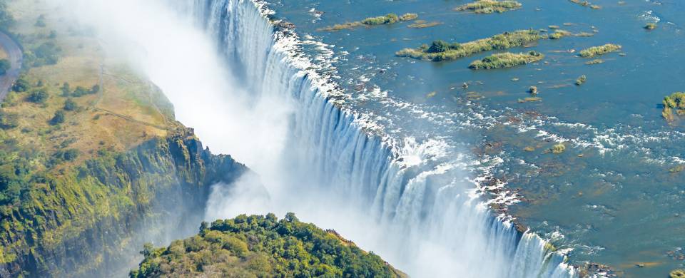 Aerial view of the dazzling blue water of Victoria Falls