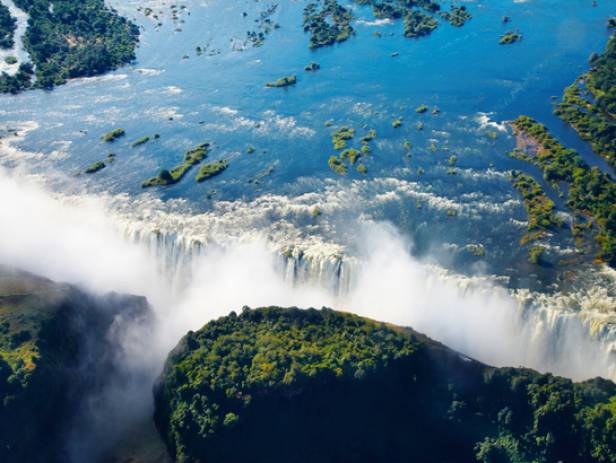 Aerial view of the dazzling blue water of Victoria Falls