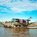 Boat making its way along the Mekong Delta near Can Tho