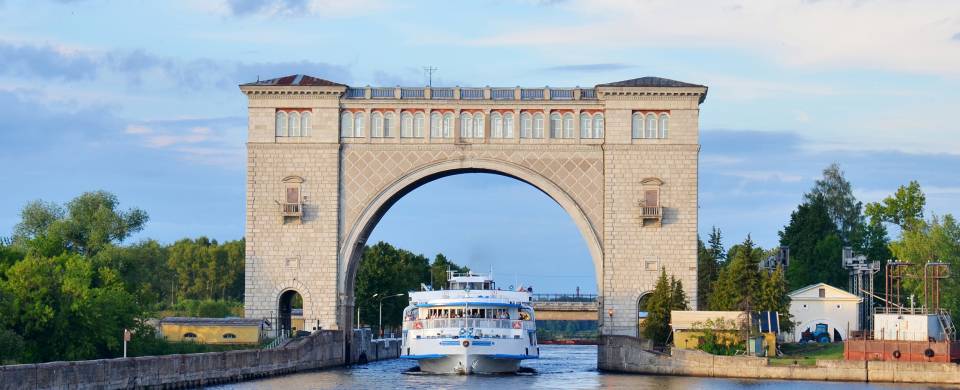 Cruise boat sailing through sluice gates on the River Volga in Russia