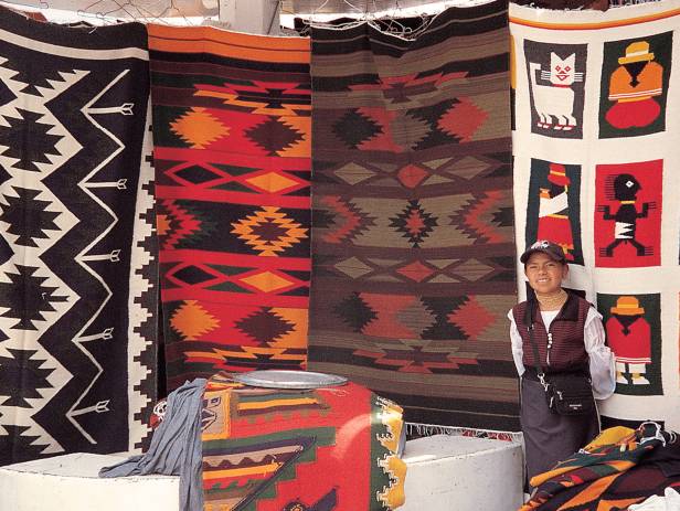 Brightly coloured textiles at a market in Otavalo