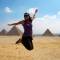 Woman jumping pyramid