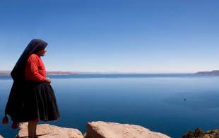 Woman overlooking Lake Titicaca - Peru - On The Go Tours