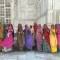 A group of Indian women in colourful saris outside the Taj Mahal