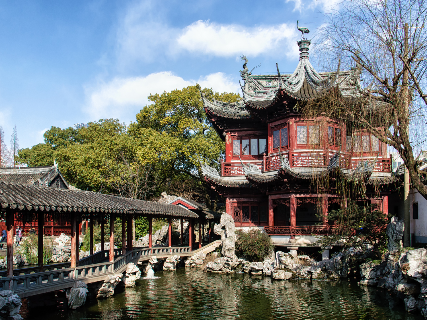 A traditional wooden pavilion and walkway in the attractive Yu Yuan Gardens in Shanghai