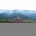 A temple of the waterfront, surrounded by lush foliage, in Dali