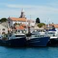 Boats in the harbour of Zadar, lit up in the evening