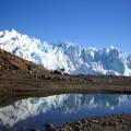 Impressive Perito Moreno glacier surrounded by snowy mountains in El Calafate