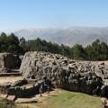 Looking out across the rooftops around the Plaza de Armas in Cuzco with the Andean mountains in the 