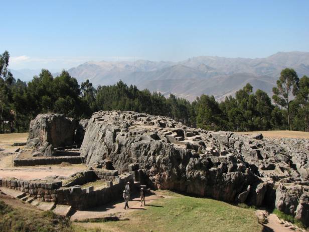 Looking out across the rooftops around the Plaza de Armas in Cuzco with the Andean mountains in the 