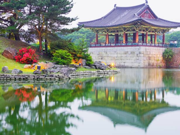 Pagodas lit up at night on the Anapji Pond in Gyeongju